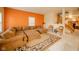 Comfortable living room featuring a large sectional sofa, decorative rug, and inviting ambiance at 10090 Eagle Eye Way, Indianapolis, IN 46234