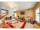 Spacious living room featuring a desk, comfortable seating, and a fireplace, perfect for relaxation at 10090 Eagle Eye Way, Indianapolis, IN 46234