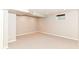 A large, carpeted basement space with a small window for natural light at 10524 Hawks Ridge Ct, Fishers, IN 46037