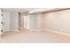 Spacious basement with carpeted floors, leading to a staircase at 10524 Hawks Ridge Ct, Fishers, IN 46037