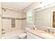 Inviting bathroom with tiled shower, tub, and a well-lit vanity area at 10524 Hawks Ridge Ct, Fishers, IN 46037