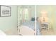 Cozy bedroom with bright green walls and a charming four-poster bed at 10524 Hawks Ridge Ct, Fishers, IN 46037