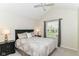 Cozy bedroom with vaulted ceilings and a view of the outdoors at 10524 Hawks Ridge Ct, Fishers, IN 46037