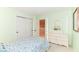 Bedroom features pastel green walls and white wood dresser set at 10524 Hawks Ridge Ct, Fishers, IN 46037