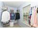Well-organized walk-in closet with ample hanging space and natural light at 10524 Hawks Ridge Ct, Fishers, IN 46037