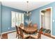 Charming dining room with natural light, table, and a chandelier for elegant dining at 10524 Hawks Ridge Ct, Fishers, IN 46037