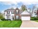 Traditional two-story home with brick and siding, attached two-car garage, and well-manicured lawn at 10524 Hawks Ridge Ct, Fishers, IN 46037