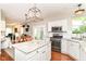 Bright, open kitchen with granite countertops, stainless appliances, adjacent dining area, and access to backyard at 10524 Hawks Ridge Ct, Fishers, IN 46037