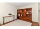 Spacious office featuring a large wooden cabinet and table, ideal for a home workspace at 10524 Hawks Ridge Ct, Fishers, IN 46037