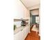 Pantry with white cabinets, granite countertops, subway tile backsplash, and a wine rack for convenient storage and organization at 10524 Hawks Ridge Ct, Fishers, IN 46037