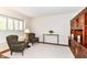 Inviting sitting room with natural light, comfortable seating, and a built-in wooden display cabinet, ideal for relaxation at 10524 Hawks Ridge Ct, Fishers, IN 46037