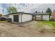 Backyard features an external garage and wooden deck at 108 W Cross St, Anderson, IN 46012
