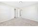 Bright bedroom features a closet, soft carpet, and neutral paint at 108 W Cross St, Anderson, IN 46012