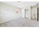 The bedroom features neutral paint, plush carpet, and a closet for storage at 108 W Cross St, Anderson, IN 46012