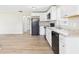 This kitchen provides ample space, featuring new countertops and flooring that are ready for modern living at 108 W Cross St, Anderson, IN 46012
