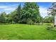 Swing set and lush green backyard at 1095 Williamsburg Ln, Zionsville, IN 46077