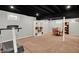Spacious basement with a treadmill, shelves, and a dining table set at 1095 Williamsburg Ln, Zionsville, IN 46077