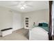 Cozy bedroom with a full bookcase, a double closet, and an inviting window at 1095 Williamsburg Ln, Zionsville, IN 46077