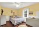 Cozy bedroom features a large window and a comfortable bed with patterned bedding at 1095 Williamsburg Ln, Zionsville, IN 46077