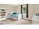 Comfortable bedroom with neutral carpet, a full bookcase, and an inviting window at 1095 Williamsburg Ln, Zionsville, IN 46077