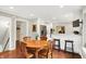 Dining area offers an open layout to the kitchen and a window seat with backyard view at 1095 Williamsburg Ln, Zionsville, IN 46077