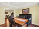 Traditional dining room featuring a wooden table, stylish chairs, and elegant decor, creating a warm, inviting ambiance at 1095 Williamsburg Ln, Zionsville, IN 46077