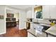 Kitchen area features granite countertops, stainless steel appliances, and hardwood floors at 1095 Williamsburg Ln, Zionsville, IN 46077