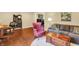 Cozy living room features hardwood floors, a comfortable sofa, a decorative chair, and a stylish coffee table at 1095 Williamsburg Ln, Zionsville, IN 46077