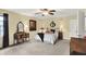 Spacious main bedroom with a ceiling fan, large windows, and a comfortable layout at 1095 Williamsburg Ln, Zionsville, IN 46077