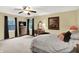 Large main bedroom featuring ample natural light, a ceiling fan, and carpeted floors at 1095 Williamsburg Ln, Zionsville, IN 46077