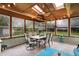 Enclosed sunroom with wood ceiling, skylights and natural light at 1095 Williamsburg Ln, Zionsville, IN 46077