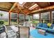 Bright sunroom with rustic wood ceiling, skylights, and plenty of light at 1095 Williamsburg Ln, Zionsville, IN 46077