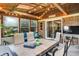 Relaxing sunroom featuring patio furniture and string lights at 1095 Williamsburg Ln, Zionsville, IN 46077