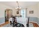 Elegant dining room with a chandelier, classic furnishings, and a view into the foyer at 1101 High Ct, Carmel, IN 46033