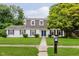 Charming two-story home with a well-manicured lawn, mature trees, and classic curb appeal at 1101 High Ct, Carmel, IN 46033