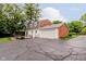 Charming home featuring brick accents, white siding, a spacious driveway, and a well-maintained attached garage at 1101 High Ct, Carmel, IN 46033