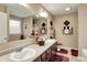 Bathroom featuring a double vanity, large mirror, and decorative accents at 1141 Lazio Ct, Greenwood, IN 46143