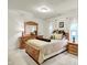 Bedroom with a decorative dresser and mirror, bedside tables, and plentiful natural light at 1141 Lazio Ct, Greenwood, IN 46143