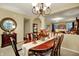 Open dining room with a view to the living area and decorative furnishings at 1141 Lazio Ct, Greenwood, IN 46143