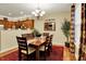 Cozy dining room with wooden table, chandelier, and access to the kitchen at 1141 Lazio Ct, Greenwood, IN 46143