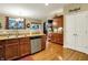 A well-equipped kitchen featuring stainless steel appliances, wooden cabinets and hardwood floors at 1141 Lazio Ct, Greenwood, IN 46143