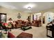 Cozy living room with comfortable sofas, a rocking chair, lamps, and neutral colored walls at 1141 Lazio Ct, Greenwood, IN 46143