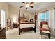 Main bedroom with a canopy bed, soft carpeting, and bright natural light at 1141 Lazio Ct, Greenwood, IN 46143