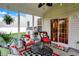 Cozy screened porch featuring comfortable seating, decor, and inviting outdoor space at 1141 Lazio Ct, Greenwood, IN 46143