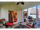 Inviting screened porch featuring comfortable seating and decor with a glimpse of the outdoors at 1141 Lazio Ct, Greenwood, IN 46143