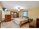 Cozy bedroom featuring a walk-in closet, ceiling fan, and warm, inviting decor at 12142 N Paddock Rd, Camby, IN 46113