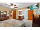 Bedroom featuring ceiling fan, en suite bathroom, and television, with warm inviting decor at 12142 N Paddock Rd, Camby, IN 46113