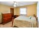 Inviting bedroom featuring a cozy bed, a window, and storage at 12142 N Paddock Rd, Camby, IN 46113