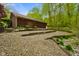 Exterior of house showcasing the gravel landscaping and wooden accents at 12142 N Paddock Rd, Camby, IN 46113