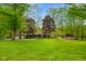 Charming single-story home with a well-manicured lawn and mature trees at 12142 N Paddock Rd, Camby, IN 46113